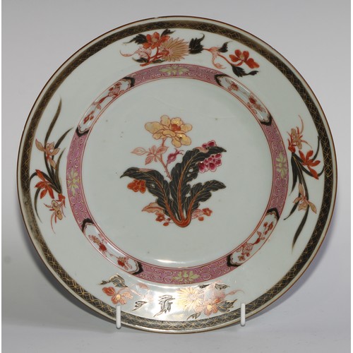 363 - A Chinese circular plate, painted in the famille rose and nor palette with flowers picked out in gil... 