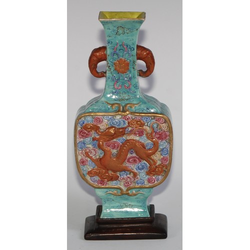 406 - A Chinese slab-sided ovoid vase, of Archaic form, moulded with dragons amongst scrolling clouds, gla... 