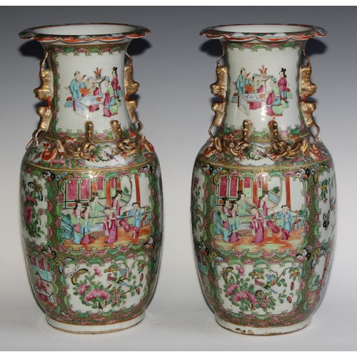 469 - A pair of Chinese famille rose ovoid vases, painted in the typical Cantonese manner with figures of ... 