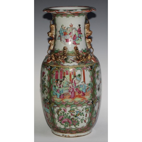 469 - A pair of Chinese famille rose ovoid vases, painted in the typical Cantonese manner with figures of ... 