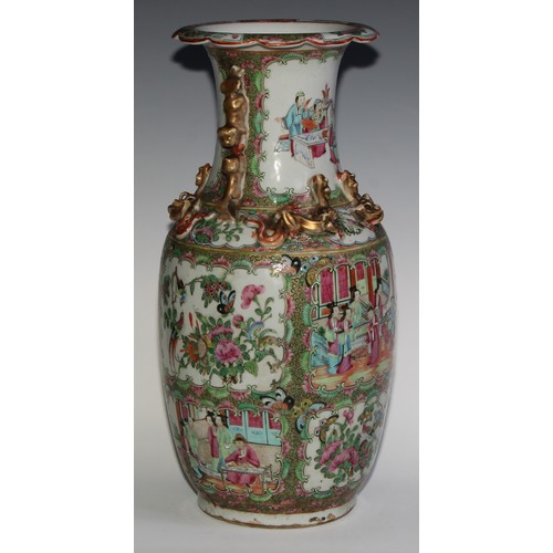 469 - A pair of Chinese famille rose ovoid vases, painted in the typical Cantonese manner with figures of ... 