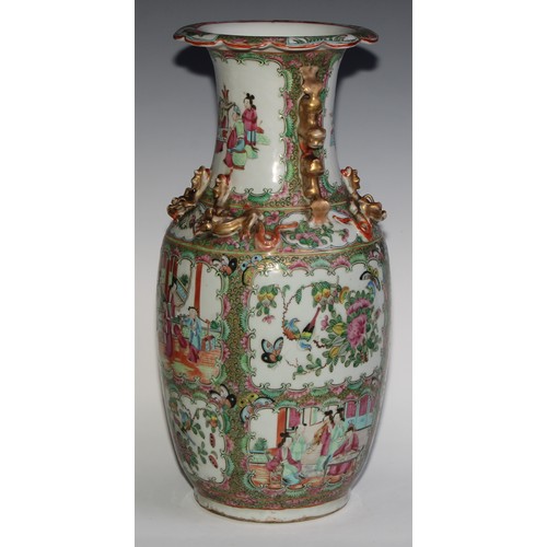 469 - A pair of Chinese famille rose ovoid vases, painted in the typical Cantonese manner with figures of ... 