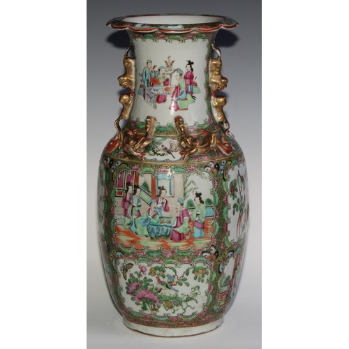 469 - A pair of Chinese famille rose ovoid vases, painted in the typical Cantonese manner with figures of ... 