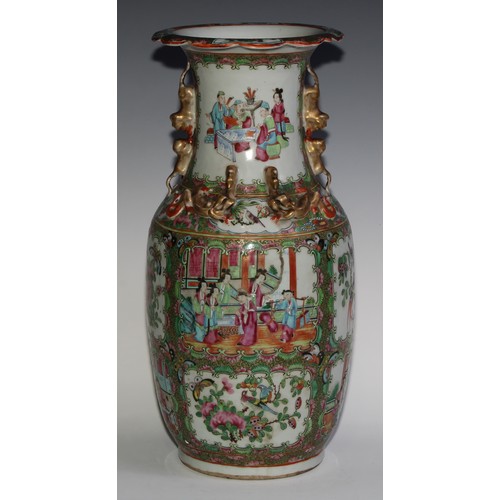 469 - A pair of Chinese famille rose ovoid vases, painted in the typical Cantonese manner with figures of ... 