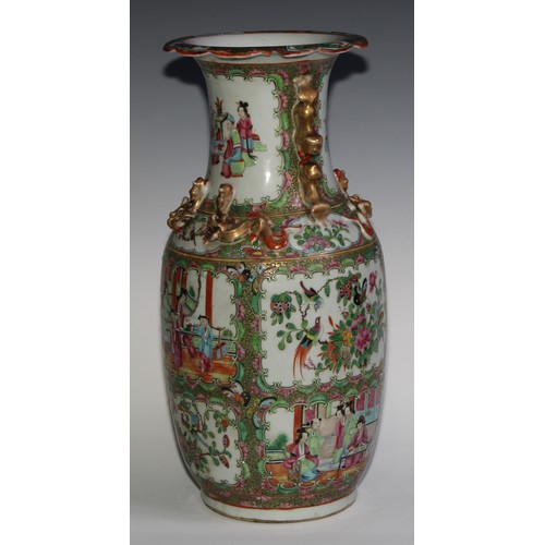 469 - A pair of Chinese famille rose ovoid vases, painted in the typical Cantonese manner with figures of ... 