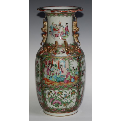 469 - A pair of Chinese famille rose ovoid vases, painted in the typical Cantonese manner with figures of ... 