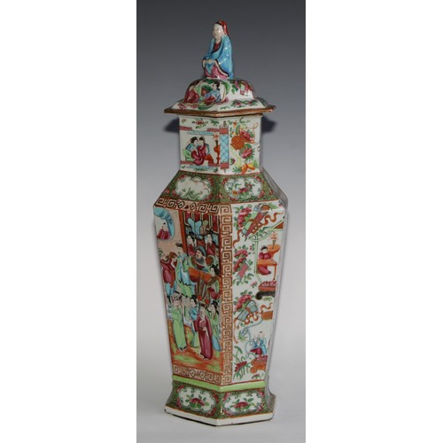 455 - A pair of Chinese famille rose hexagonal vases and covers, painted in the typical Cantonese manner w... 