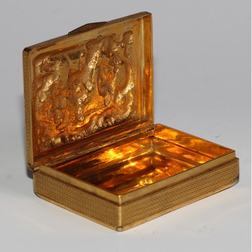 857 - A 19th century silver-gilt rectangular snuff box, hinged cover cast in relief with a scene from Clas... 