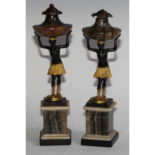 2321 - A pair of Derbyshire Blue John and parcel gilt dark patinated bronze figural mantel urns, each crest... 