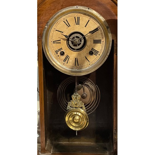 2410 - An early 20th century American gingerbread form mantel clock, by the Ansonia Clock Co., New York, Un... 