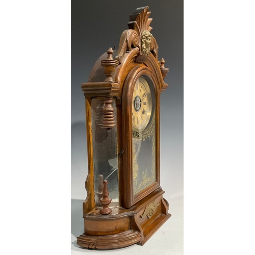 2410 - An early 20th century American gingerbread form mantel clock, by the Ansonia Clock Co., New York, Un... 