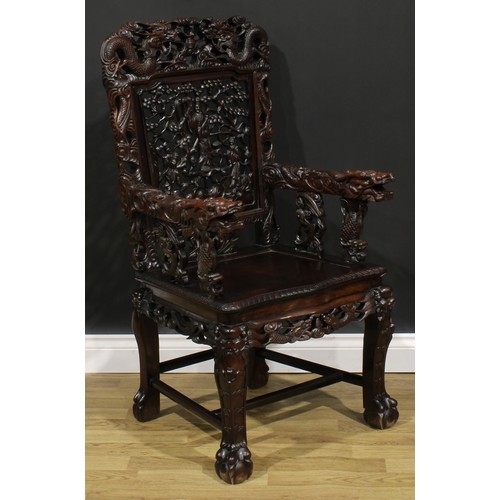 1651 - A Chinese hardwood armchair, shaped cresting rail pierced and carved with two dragons and a flaming ... 