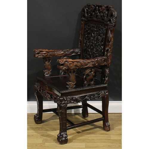 1651 - A Chinese hardwood armchair, shaped cresting rail pierced and carved with two dragons and a flaming ... 