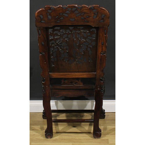 1651 - A Chinese hardwood armchair, shaped cresting rail pierced and carved with two dragons and a flaming ... 