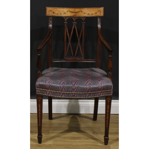 1981 - A pair of Sheraton Revival mahogany and marquetry elbow chairs, each cresting rail inlaid with an ur... 