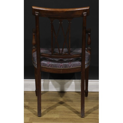 1981 - A pair of Sheraton Revival mahogany and marquetry elbow chairs, each cresting rail inlaid with an ur... 