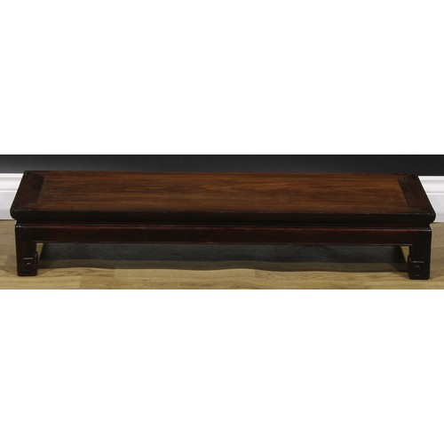 2032 - A Chinese hardwood waisted low kang table, 16.5cm high, 98.5cm long, 35.5cm wide