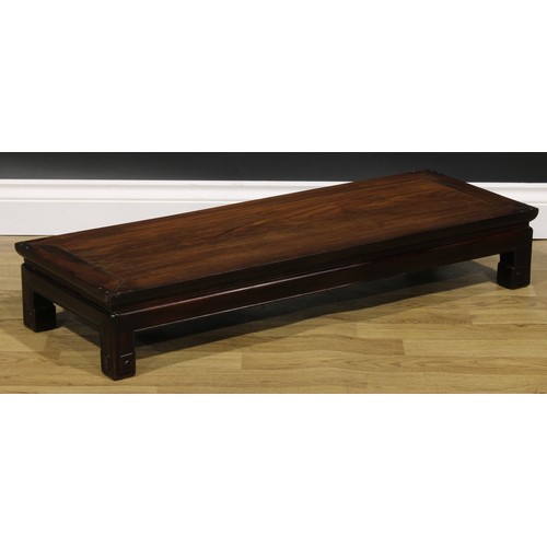 2032 - A Chinese hardwood waisted low kang table, 16.5cm high, 98.5cm long, 35.5cm wide