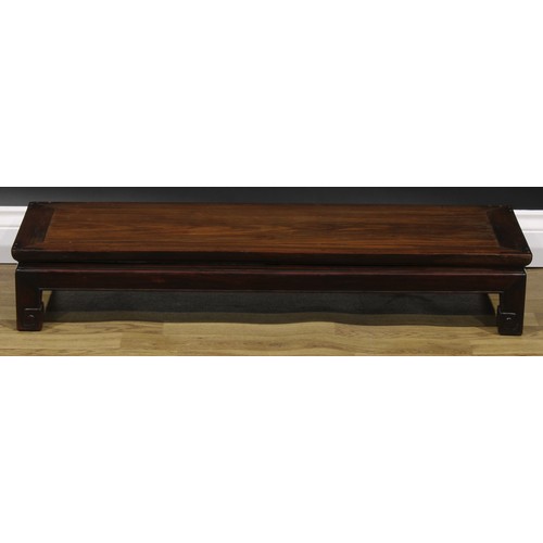 2032 - A Chinese hardwood waisted low kang table, 16.5cm high, 98.5cm long, 35.5cm wide