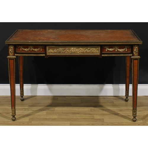 1964 - A Louis XVI Revival gilt metal mounted bureau plat, rectangular top with inset tooled and gilt writi... 