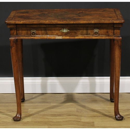 2112 - A George II walnut side table, featherbanded rounded rectangular top with moulded edge above a long ... 