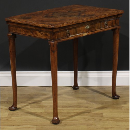 2112 - A George II walnut side table, featherbanded rounded rectangular top with moulded edge above a long ... 