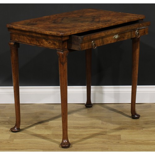 2112 - A George II walnut side table, featherbanded rounded rectangular top with moulded edge above a long ... 