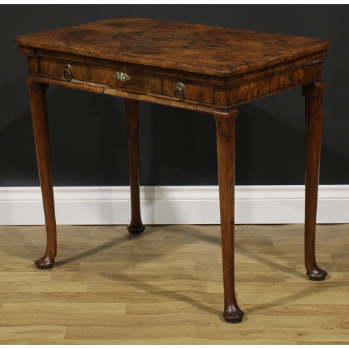 2112 - A George II walnut side table, featherbanded rounded rectangular top with moulded edge above a long ... 