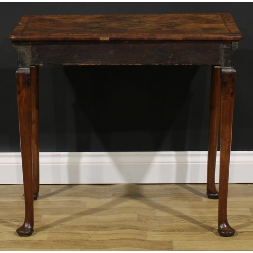 2112 - A George II walnut side table, featherbanded rounded rectangular top with moulded edge above a long ... 