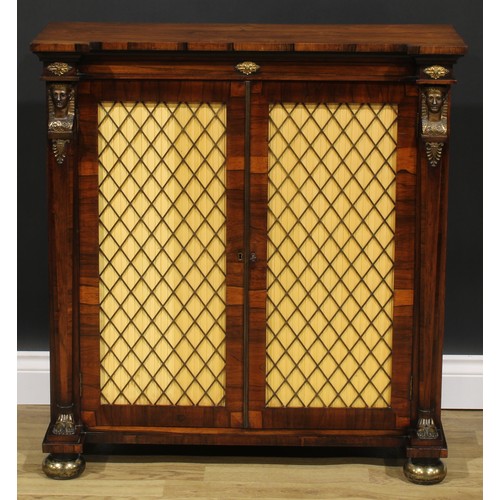 2353 - A Regency Egyptian Revival gilt metal mounted rosewood side cabinet, slightly oversailing top above ... 