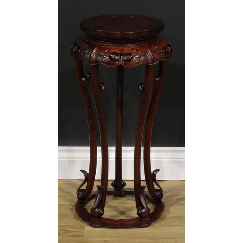 2026 - A Chinese hardwood jardiniere stand, shaped circular top, pumpkin shaped apron, cabriole supports, s... 