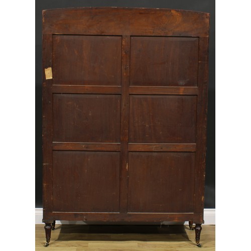 2364 - A Regency mahogany waterfall bookcase, open shelves above a pair of panel doors, turned feet, brass ... 