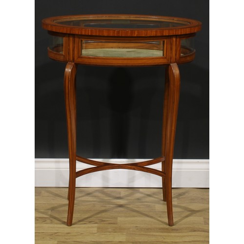 2559 - A Sheraton Revival satinwood bijouterie table, oval rosewood crossbanded hinged glazed top, slender ... 