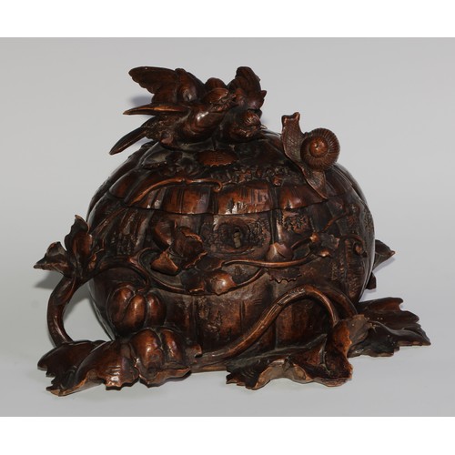 2549 - A sculptural 19th century Black Forest table casket, profusely carved as birds and a snail upon a pu... 