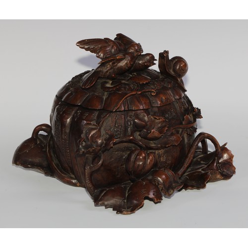 2549 - A sculptural 19th century Black Forest table casket, profusely carved as birds and a snail upon a pu... 