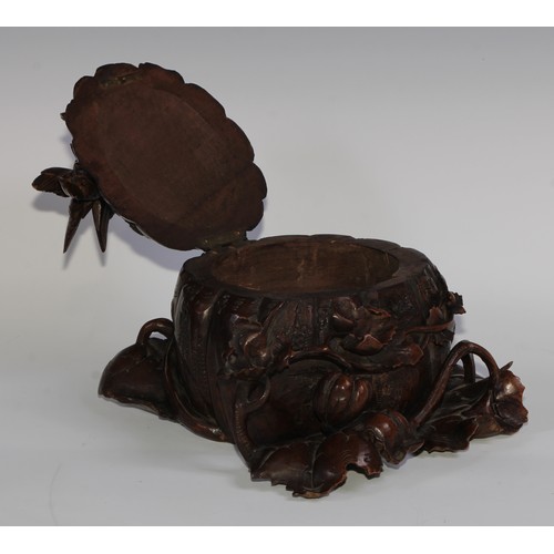 2549 - A sculptural 19th century Black Forest table casket, profusely carved as birds and a snail upon a pu... 