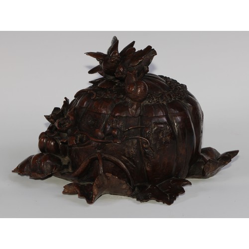 2549 - A sculptural 19th century Black Forest table casket, profusely carved as birds and a snail upon a pu... 