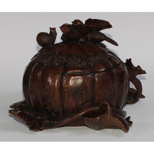 2549 - A sculptural 19th century Black Forest table casket, profusely carved as birds and a snail upon a pu... 