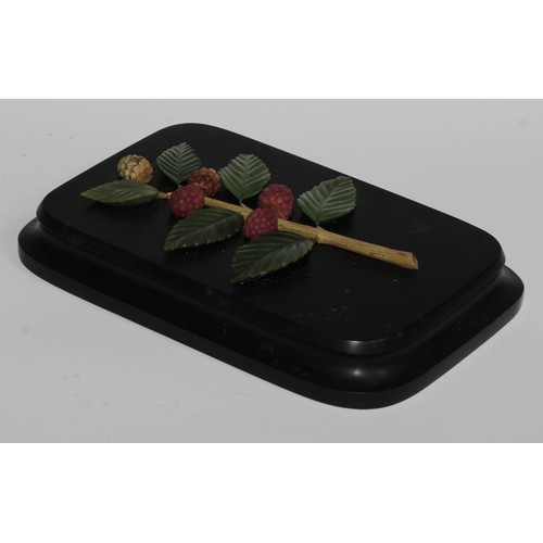 2548 - A Russian specimen hardstone desk weight, applied and inlaid with a branch of raspberries, waisted r... 