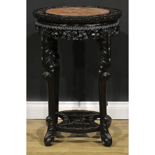 1776 - A Chinese hardwood fish bowl stand, octofoil top carved in relief with flower heads and scrolling ac... 