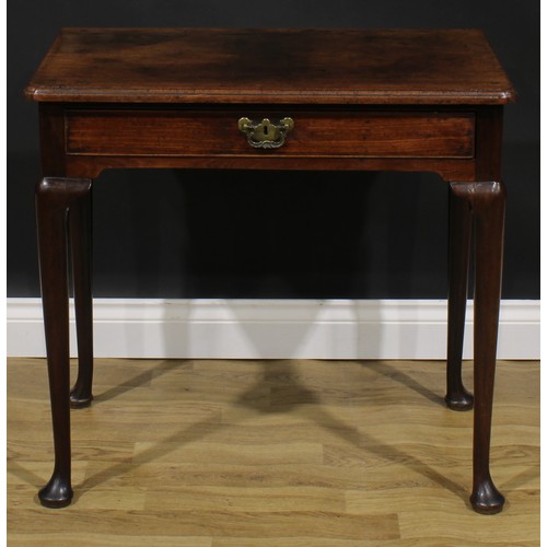 1733 - A George II mahogany side table, oversailing top with moulded edge above a long cockbeaded frieze dr... 