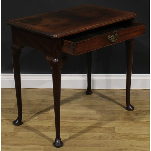 1733 - A George II mahogany side table, oversailing top with moulded edge above a long cockbeaded frieze dr... 