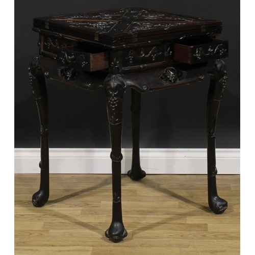 1654 - A Chinese hardwood envelope card table, hinged quadripartite top enclosing a playing surface and cou... 