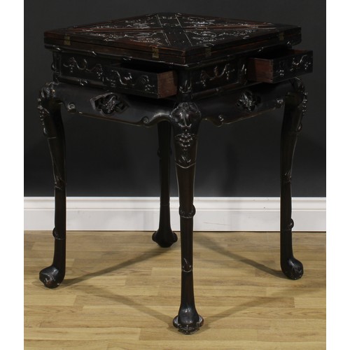 1654 - A Chinese hardwood envelope card table, hinged quadripartite top enclosing a playing surface and cou... 