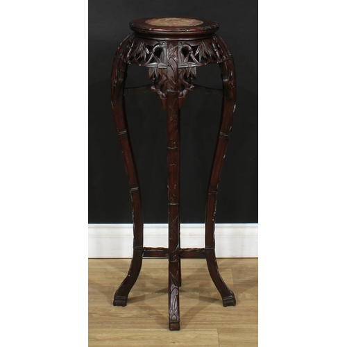 2101 - A Chinese hardwood jardiniere stand, circular top with inset soapstone panel, above a shaped frieze ... 