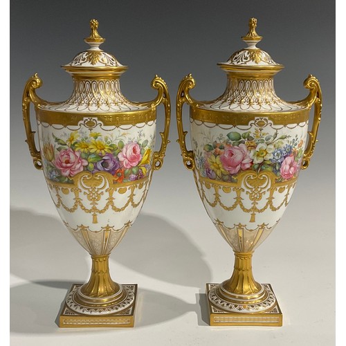 261 - A pair of Royal Crown Derby twin handled pedestal urns and covers, painted by Albert Gregory, signed... 