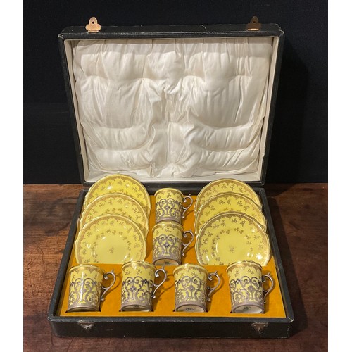 170 - A set of six Coalport coffee cans and saucers, gilt floral flowers on a primrose yellow ground, each... 