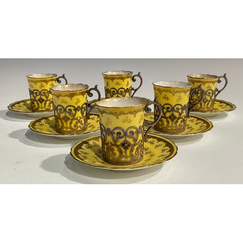 170 - A set of six Coalport coffee cans and saucers, gilt floral flowers on a primrose yellow ground, each... 