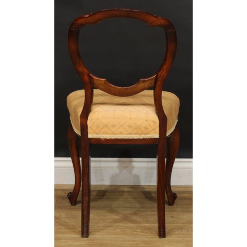 2182 - A set of four Victorian rosewood balloon back dining chairs, each with a shaped back carved and appl... 