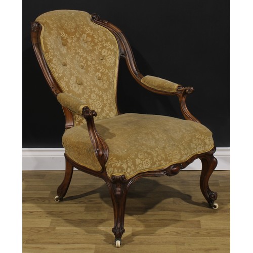 2289 - A Victorian walnut drawing room chair, stuffed-over upholstery, cabriole forelegs, ceramic casters, ... 